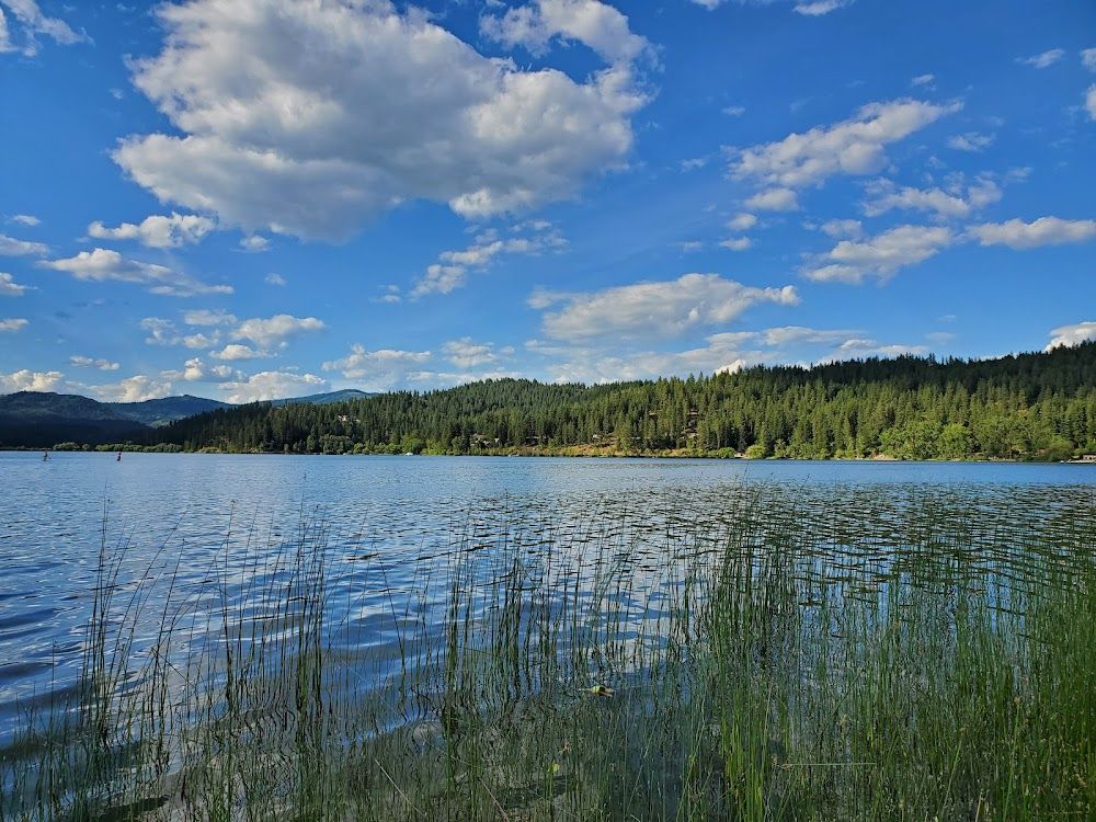Hauser Lake on a clear summer afternoon. Onyx & Oak Homes builds custom homes in Hauser & Newman Lake, Idaho.