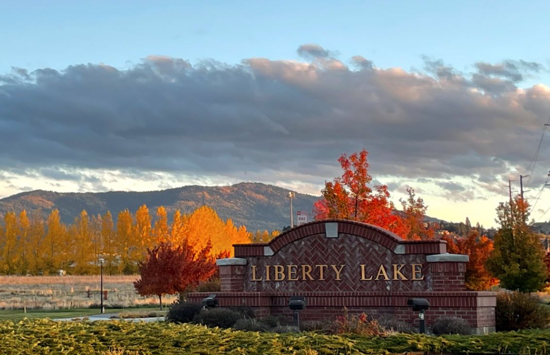 The Liberty Lake entrance sign in autumn colour. Onyx & Oak Homes builds custom homes in Liberty Lake, Washington.